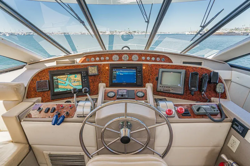 Slide: The Image of Cockpit of 2000 Bayliner 5788 Pilot House Motoryacht with navigation equipment and steering wheel. - 41