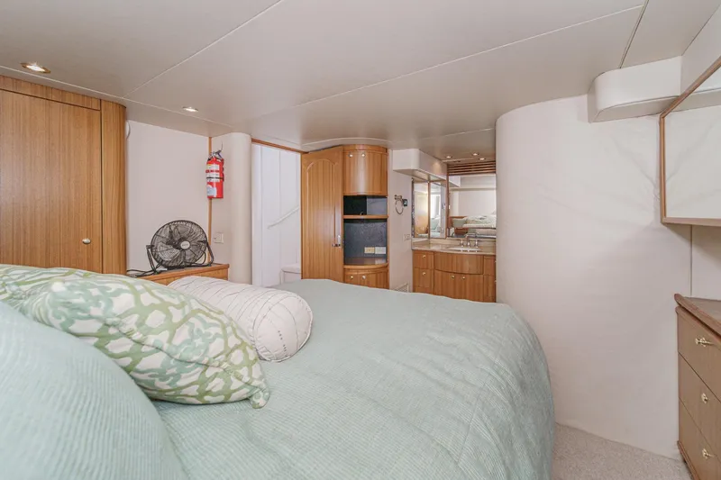 Slide: The Image of Luxurious bedroom interior of 2000 Bayliner 5788 Pilot House Motoryacht with modern amenities. - 45