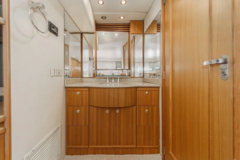 Slide: The Image of Luxurious bathroom interior of 2000 Bayliner 5788 Pilot House Motoryacht with wooden cabinetry. - 46