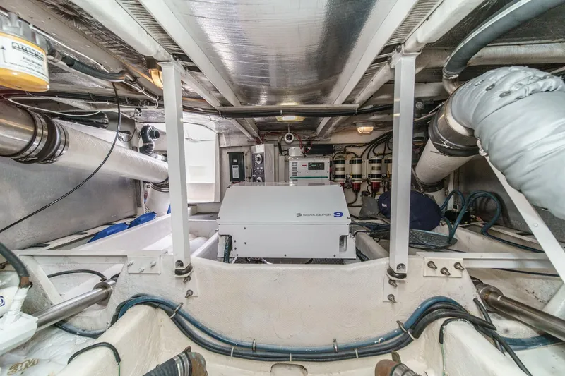 Slide: The Image of Engine room of 2000 Bayliner 5788 Pilot House Motoryacht with Seakeeper 9 stabilizer. - 60