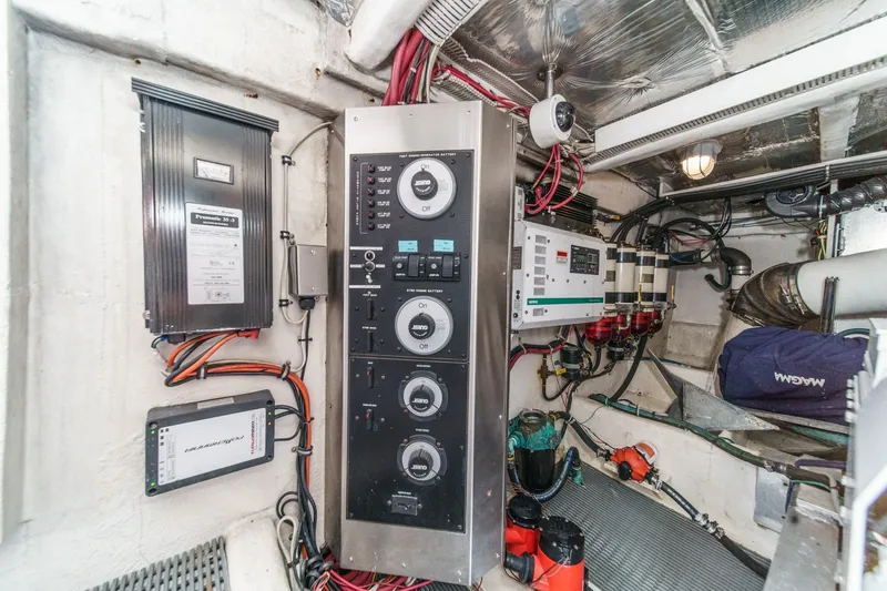 Slide: The Image of Engine room of 2000 Bayliner 5788 Pilot House Motoryacht with control panels and wiring. - 63