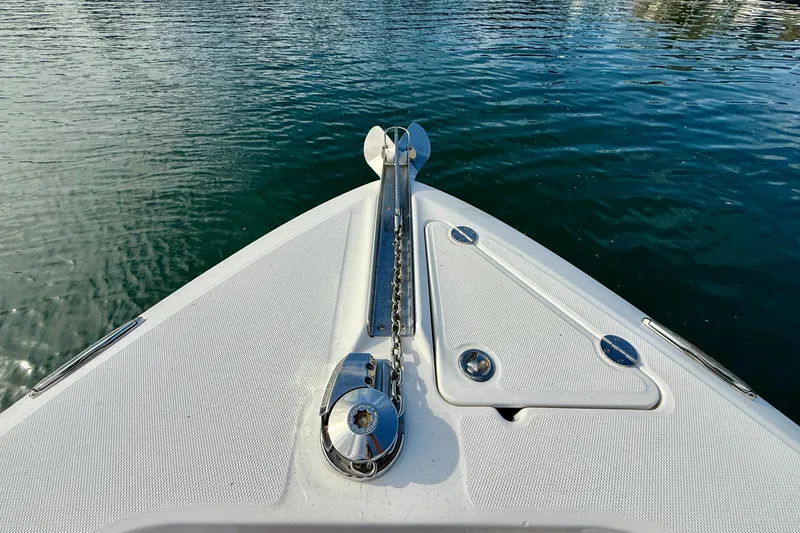 Slide: The Image of Bow of 2008 Everglades 290 Center Console boat on calm water. - 11