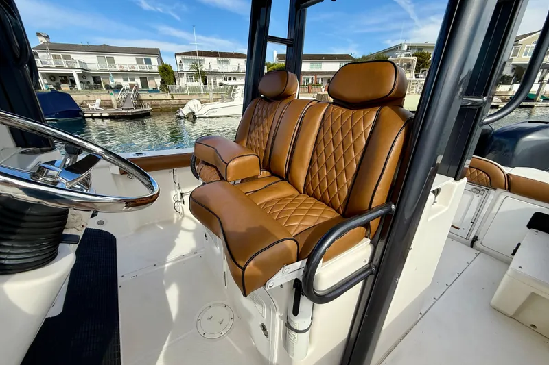 Slide: The Image of Luxurious leather seating on 2008 Everglades 290 Center Console boat, docked in marina. - 12