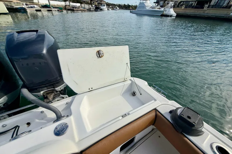 Slide: The Image of 2008 Everglades 290 Center Console boat with open hatch, docked in marina. - 15