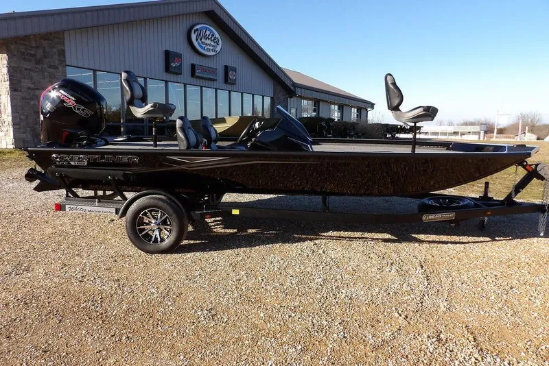 The Image of 2026 Crestliner XFC 189 fishing boat on trailer outside marine center. - 0