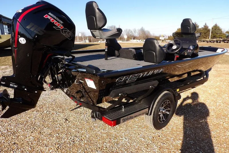 Slide: The Image of 2026 Crestliner XFC 189 fishing boat with Mercury Pro XS engine on a trailer. - 12