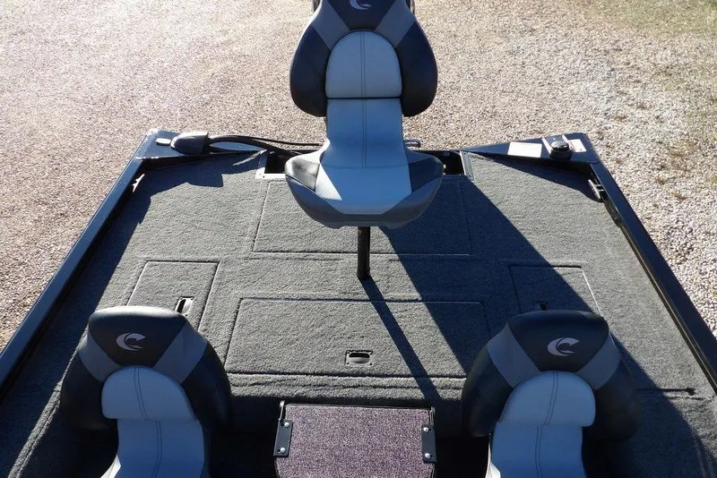 Slide: The Image of 2026 Crestliner XFC 189 boat interior with three cushioned seats on a carpeted deck. - 16