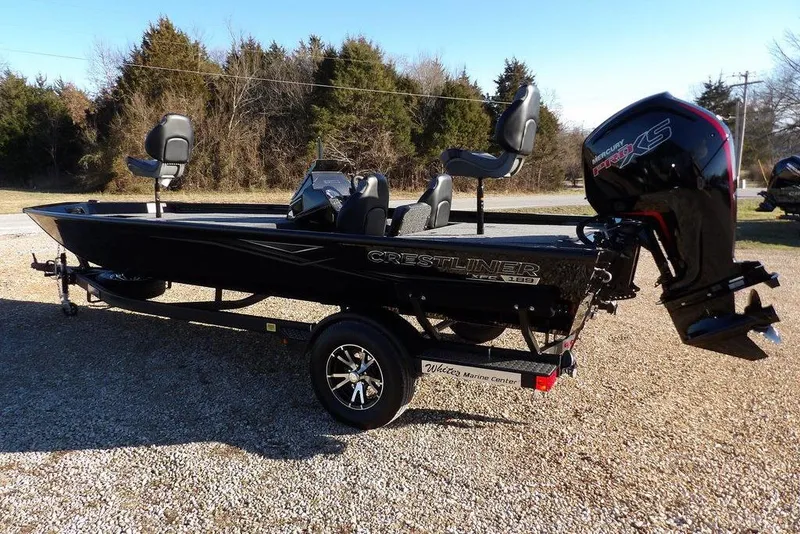 Slide: The Image of 2026 Crestliner XFC 189 fishing boat with Mercury Pro XS engine on a trailer. - 2