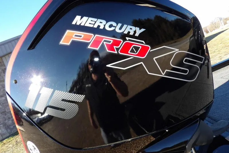 Slide: The Image of Mercury Pro XS 115 engine on 2026 Crestliner XFC 189 boat, reflecting sunlight. - 26