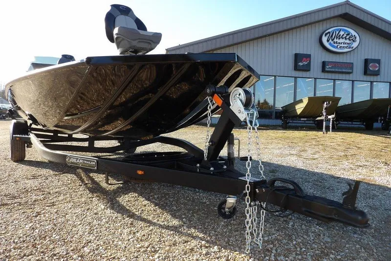 Slide: The Image of 2026 Crestliner XFC 189 boat on trailer outside White's Marine Center. - 35