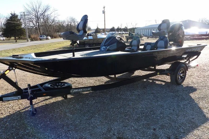 Slide: The Image of 2026 Crestliner XFC 189 fishing boat on trailer, parked outdoors. - 4