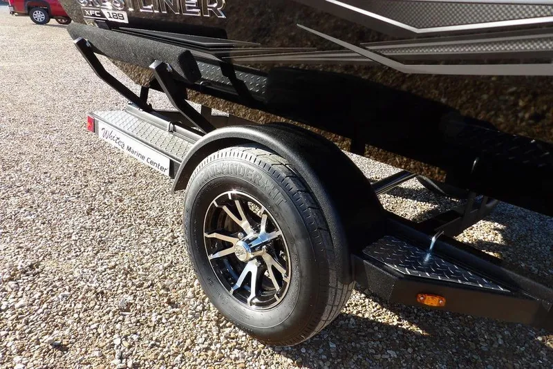 Slide: The Image of 2026 Crestliner XFC 189 boat trailer with sleek black design and alloy wheels. - 40