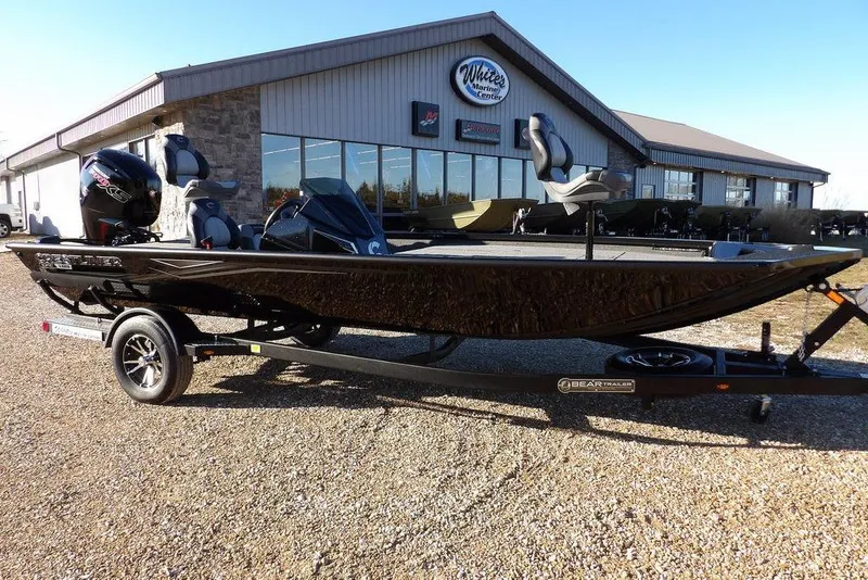 Slide: The Image of 2026 Crestliner XFC 189 fishing boat on trailer outside marine center. - 41