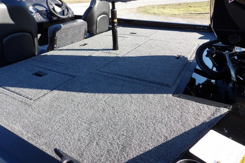 Slide: The Image of 2026 Crestliner XFC 189 boat interior with spacious carpeted deck and seating. - 6