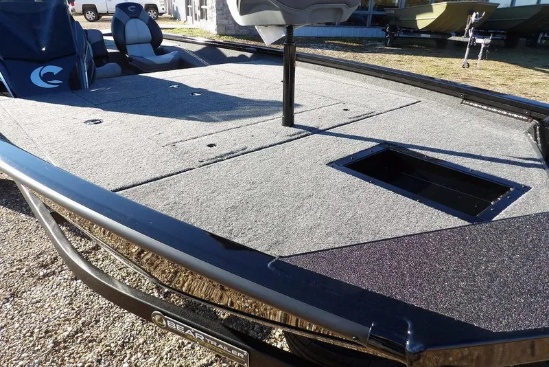 Slide: The Image of 2026 Crestliner XFC 189 fishing boat with spacious deck and storage compartment. - 9