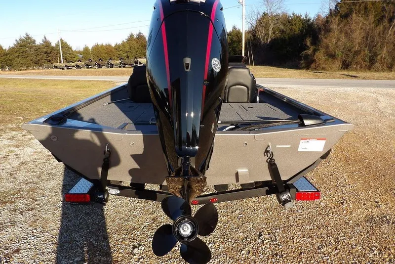 Slide: The Image of Crestliner XFC 189 2026 boat with carpeted deck and storage compartments. - 10