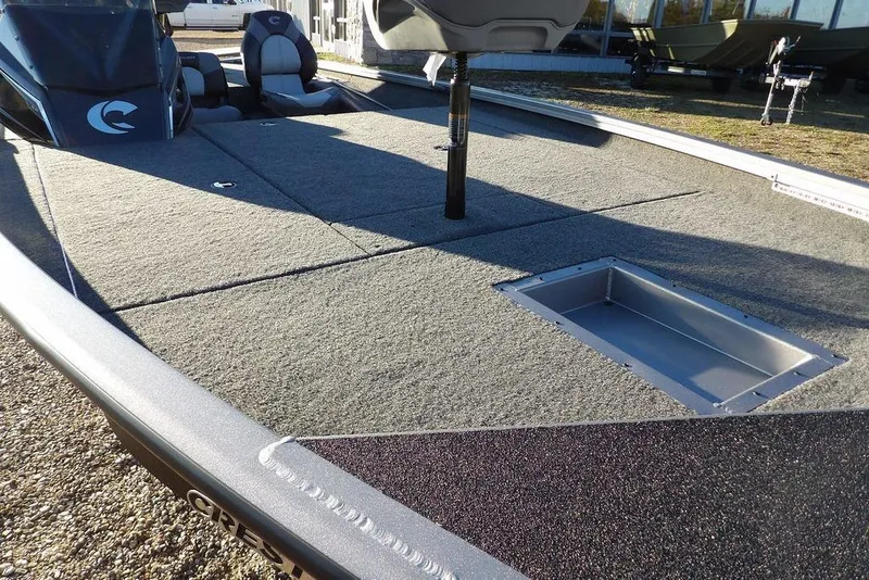 Slide: The Image of Crestliner XFC 189 2026 boat deck with gray carpet. - 12