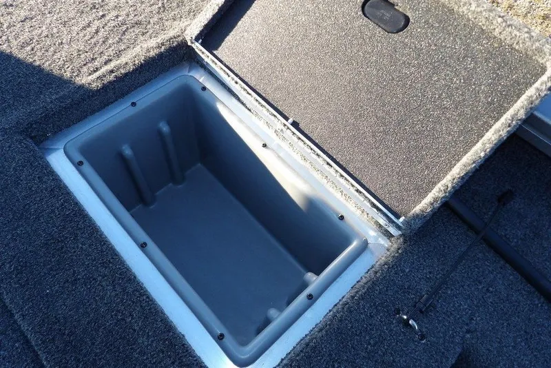Slide: The Image of Open storage compartment in Crestliner XFC 189 boat, year 2026. - 16