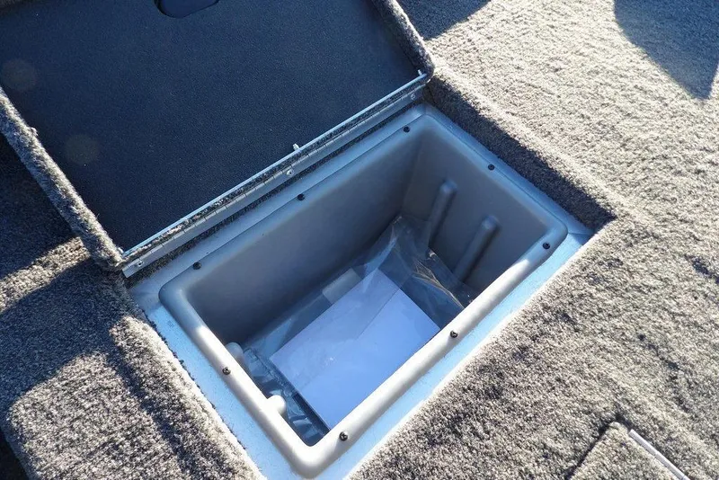 Slide: The Image of Crestliner XFC 189 2026 boat hatch with storage compartment. - 17