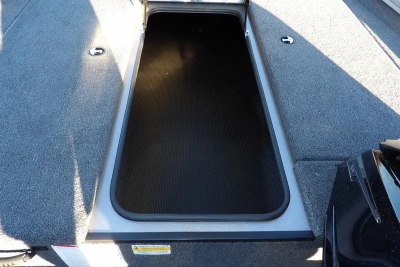 Slide: The Image of Crestliner XFC 189 2026 boat deck with storage compartments. - 25