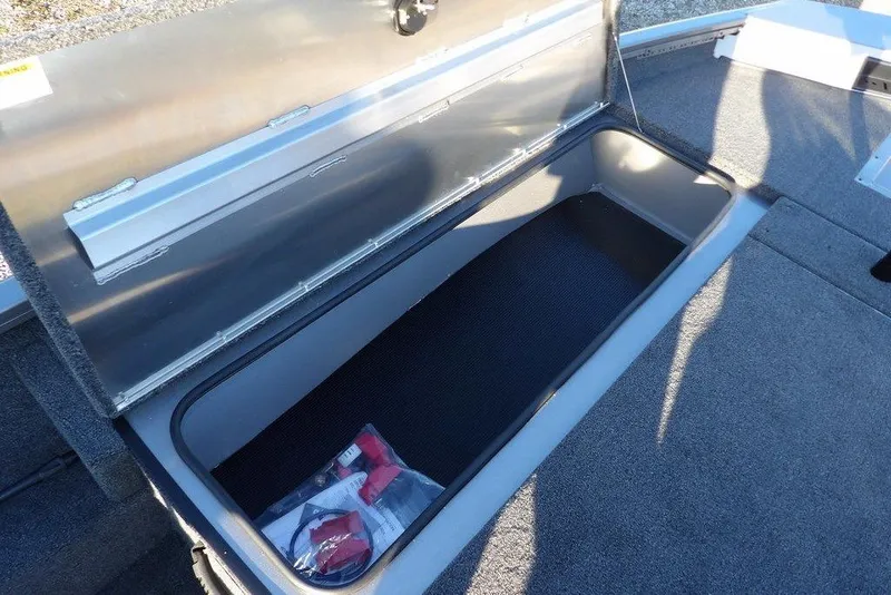 Slide: The Image of Open storage compartment in Crestliner XFC 189 boat, year 2026. - 27