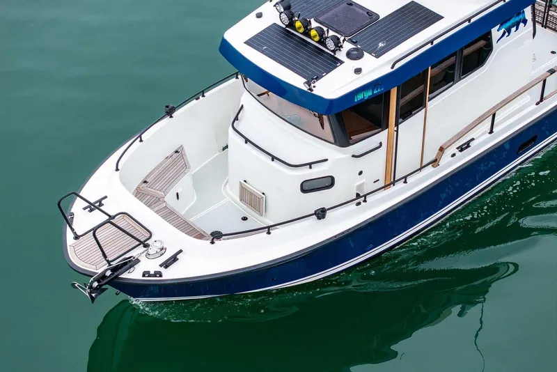 Slide: The Image of 2024 Targa 27.2 boat on water, showcasing sleek design and modern features. - 14