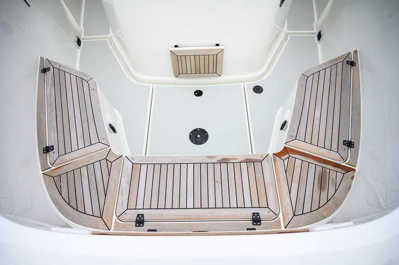 Slide: The Image of 2024 Targa 27.2 boat interior with wooden deck and seating area. - 20