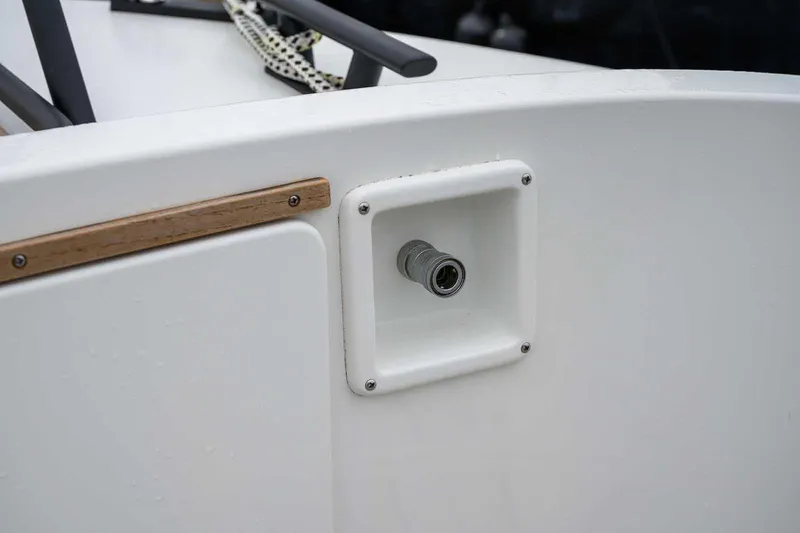 Slide: The Image of 2024 Targa 27.2 boat detail showing a water connection port. - 22
