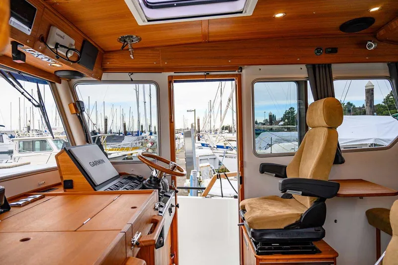 Slide: The Image of 2024 Targa 27.2 boat interior with navigation equipment and comfortable seating. - 39