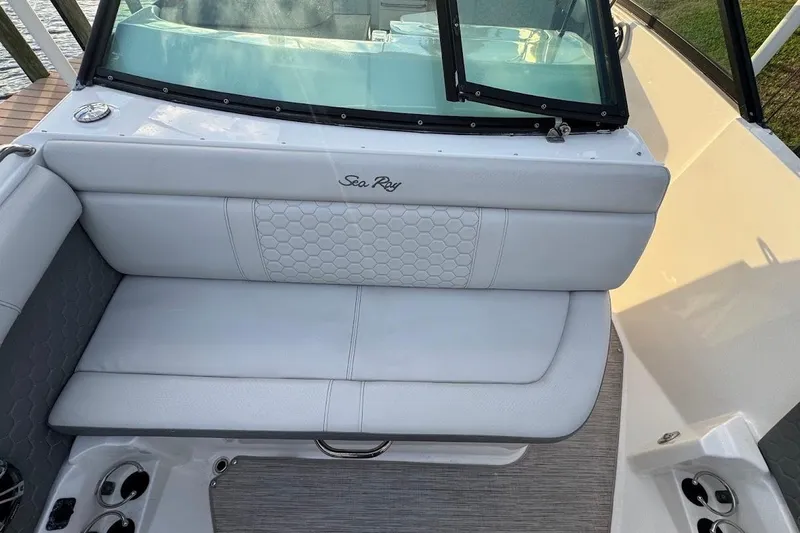 Slide: The Image of 2020 Sea Ray SDX 250 Outboard boat on calm water near a dock. - 10