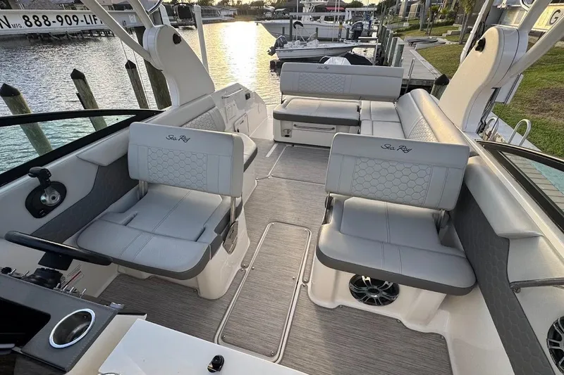 Slide: The Image of 2020 Sea Ray SDX 250 Outboard boat on lift, dockside view. - 13