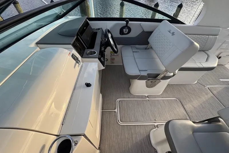 Slide: The Image of 2020 Sea Ray SDX 250 Outboard boat on lift at marina dock. - 14