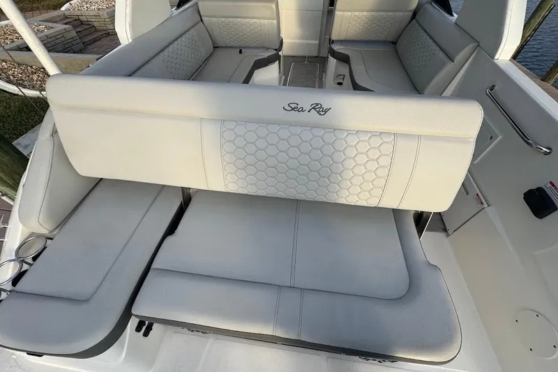 Slide: The Image of 2020 Sea Ray SDX 250 Outboard boat interior with plush seating and sleek design. - 21