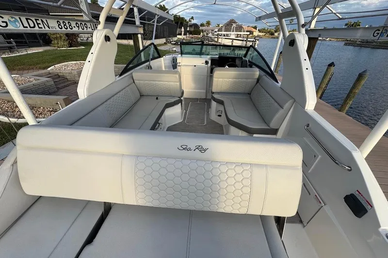 Slide: The Image of 2020 Sea Ray SDX 250 Outboard boat interior with white cushioned seating. - 22
