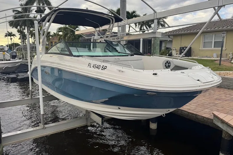 Slide: The Image of 2020 Sea Ray SDX 250 Outboard boat interior with spacious seating and elegant design. - 34