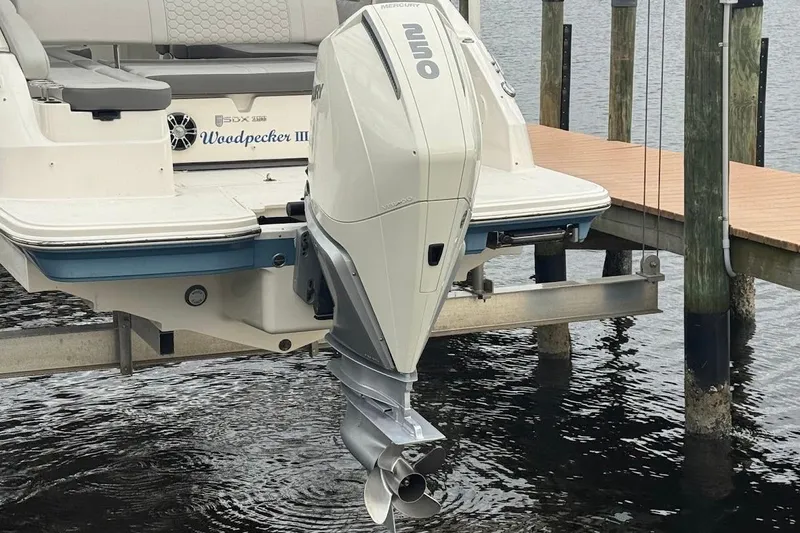 Slide: The Image of 2020 Sea Ray SDX 250 Outboard boat cruising on a sunny waterfront. - 7