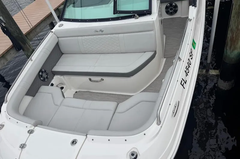 Slide: The Image of 2020 Sea Ray SDX 250 Outboard boat on calm water near a dock. - 9