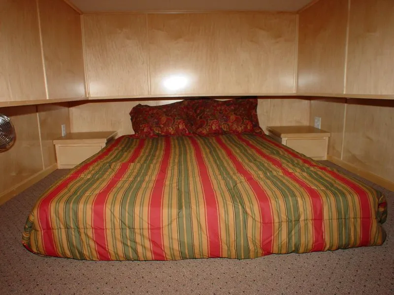 Slide: The Image of Bedroom with striped bedding in Stardust Cruisers San Juan Sunrise 2004. - 7