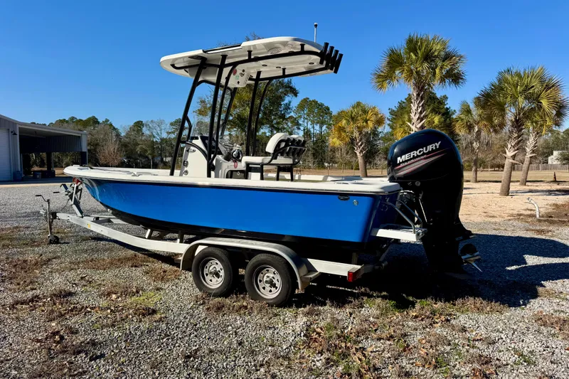 Slide: The Image of 2018 Sea Pro 208 Bay boat with Mercury engine on trailer, parked outdoors. - 3