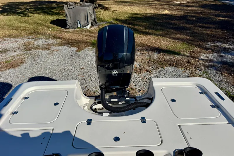 Slide: The Image of 2018 Sea Pro 208 Bay boat with outboard motor, parked on gravel. - 8