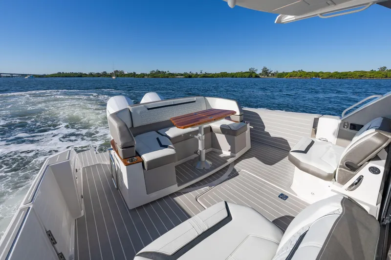 Slide: The Image of Luxurious 2025 Tiara Yachts 43 LE with elegant seating and scenic water view. - 11