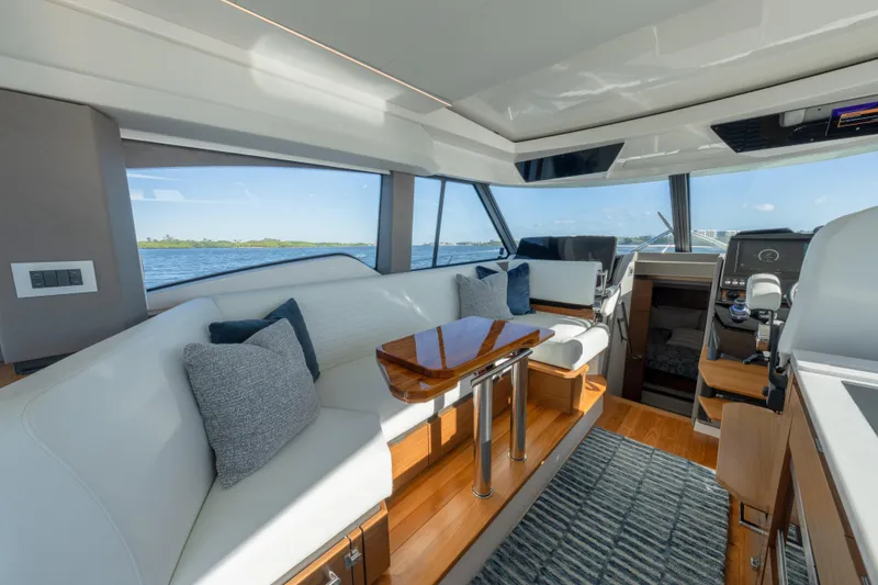 Slide: The Image of Luxurious interior of 2025 Tiara Yachts 43 LE with elegant seating and scenic views. - 18