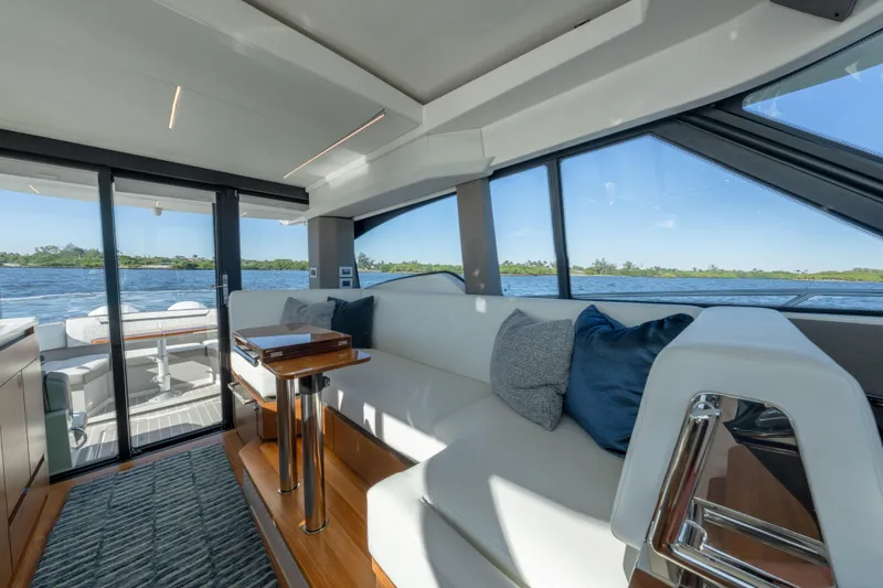 Slide: The Image of Luxurious interior of 2025 Tiara Yachts 43 LE, featuring elegant seating and scenic water views. - 24