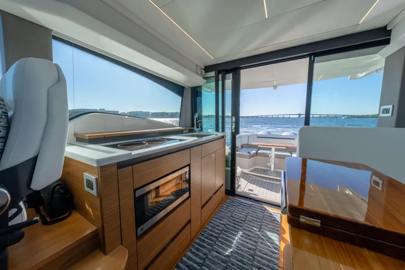 Slide: The Image of Luxurious interior of 2025 Tiara Yachts 43 LE with modern kitchen and ocean view. - 25