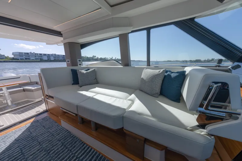 Slide: The Image of Luxurious interior of 2025 Tiara Yachts 43 LE with elegant seating and scenic water view. - 27