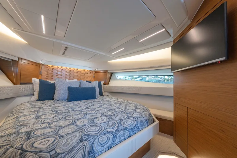 Slide: The Image of Luxurious 2025 Tiara Yachts 43 LE bedroom with modern design and elegant bedding. - 33