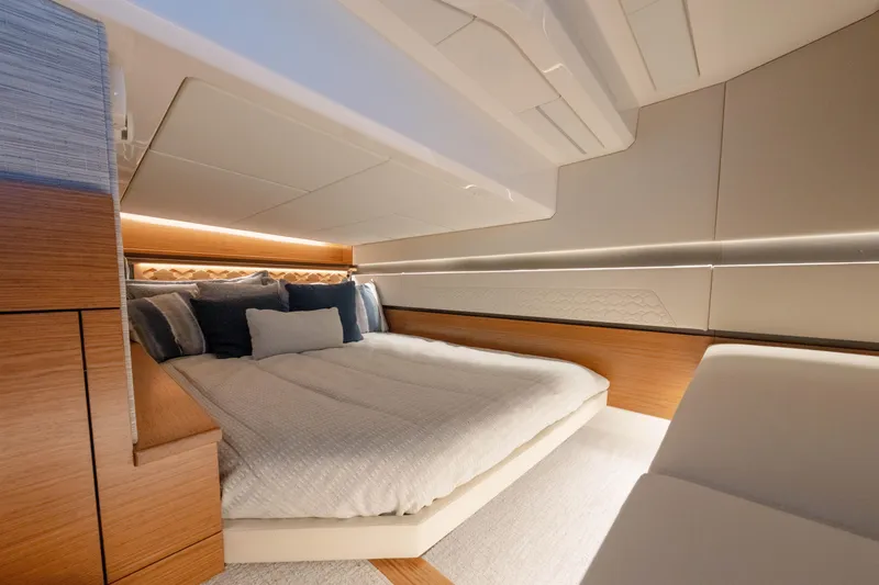 Slide: The Image of Luxurious interior cabin of 2025 Tiara Yachts 43 LE, featuring elegant bedding and modern design. - 39