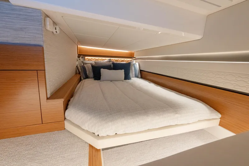 Slide: The Image of Luxurious cabin interior of 2025 Tiara Yachts 43 LE with cozy bedding. - 40