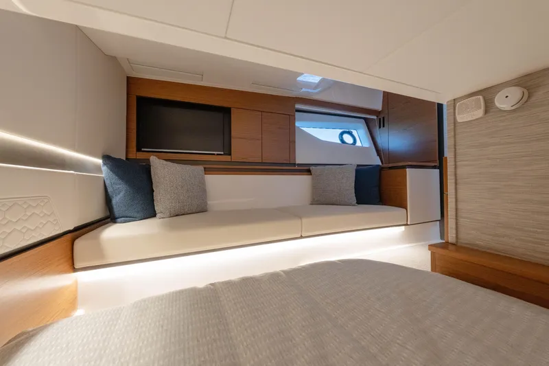 Slide: The Image of Luxurious interior of 2025 Tiara Yachts 43 LE with modern seating and TV. - 41