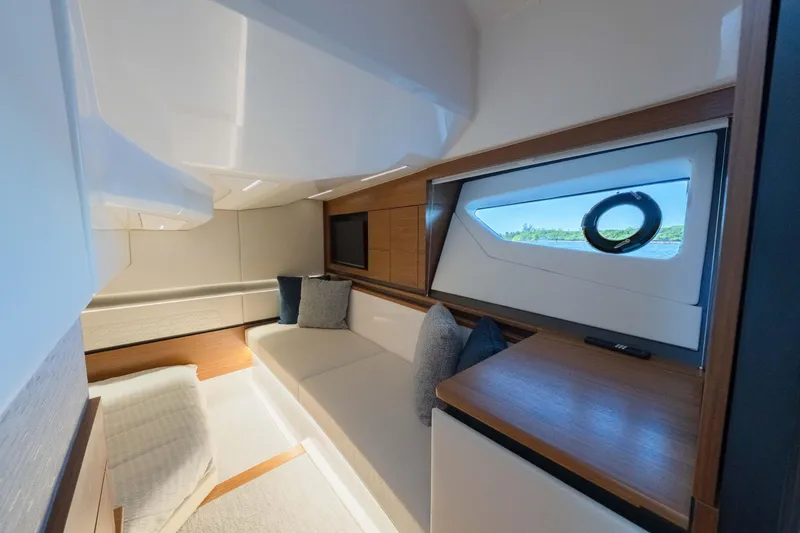 Slide: The Image of Luxurious interior of 2025 Tiara Yachts 43 LE, featuring elegant seating and scenic window view. - 42